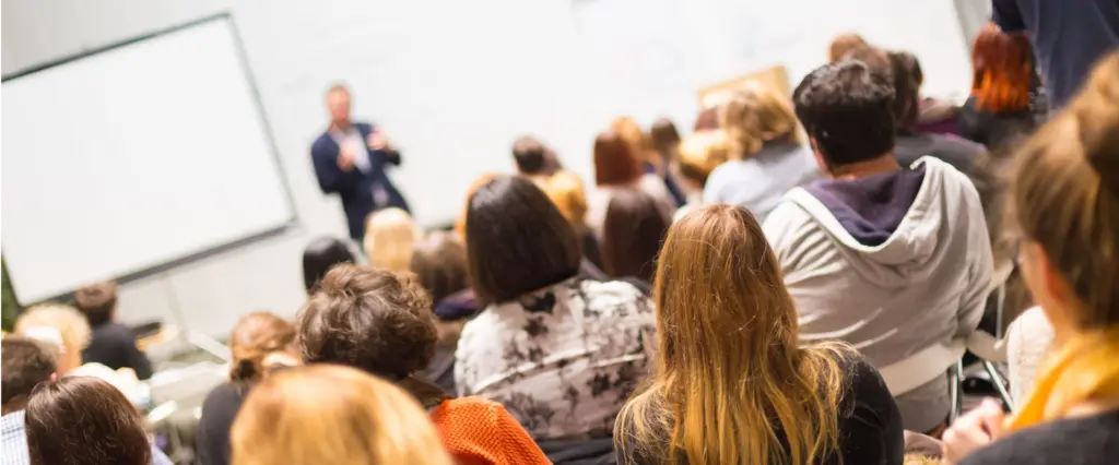 Enda O'Doherty delivering a high impact corporate keynote to a large audience, available for conferences, webinars and seminars across Ireland and the UK